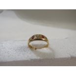 18ct gold ring with three small diamonds spaced by two rubies, double struck British hallmarks, 3.