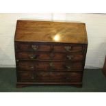 Late Georgian mahogany bureau with two short over three long graduated drawers bearing replacement
