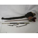 A short sword with brass guard lined with suede and velvet, shagreen grip, cotton tassells overall