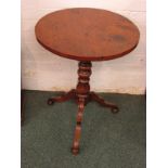 A circular side table, the 19th century mahogany base with turned baluster column and standing on
