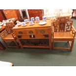 A far Eastern light wood sideboard with three short drawers to top and slatted under tier, with