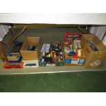 Two boxes of loose 00 gauge rolling stock, assorted empty rolling stock boxes, power control unit,