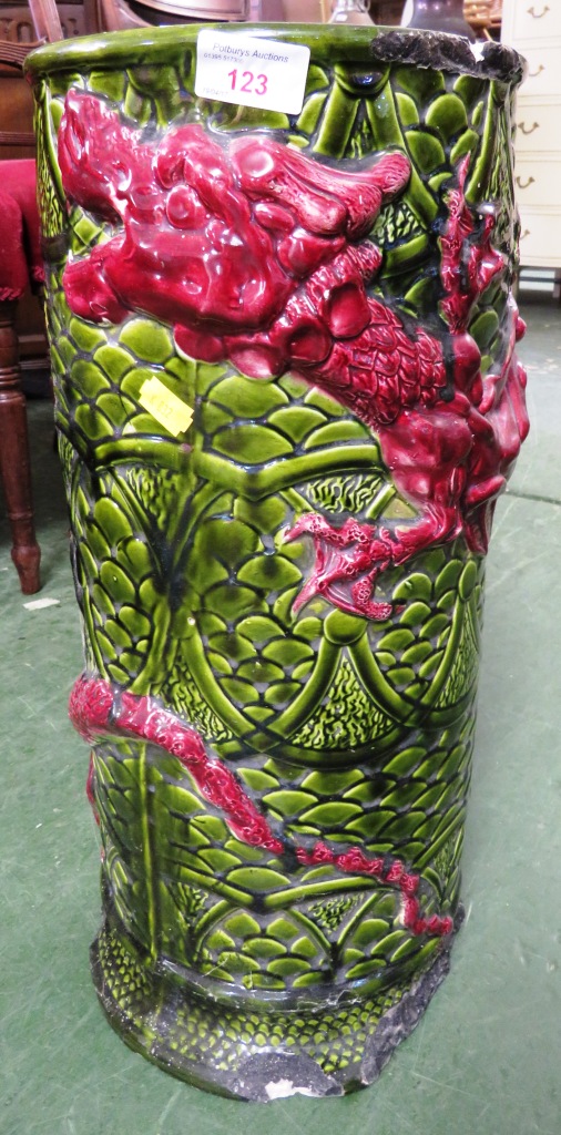 GREEN AND RED GLAZED CERAMIC UMBRELLA AND STICK STAND DECORATED WITH DRAGON (A/F)