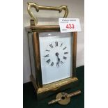 BRASS CASED CARRIAGE CLOCK WITH UNSIGNED ENAMEL DIAL, WITH WINDING KEY, MOVEMENT MARKED 'MADE IN