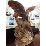 CARVED WOODEN BLACK FOREST STYLE EAGLE GRASPING GOAT