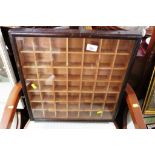 SMALL GLAZED DISPLAY CABINET WITH FORTY NINE COMPARTMENTS, BACK WITH LABEL 'JAMES GARDNER NATURAL