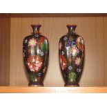 PAIR OF SMALL BLACK GROUND RIBBED CLOISONNE ENAMELLED VASES PATTERNED WITH VARIOUS FLOWERS AND