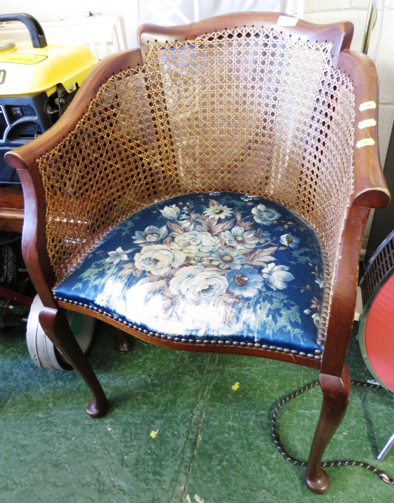 MAHOGANY FRAMED CANE BACK TUB CHAIR WITH FOLIATE UPHOLSTERED SEAT