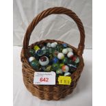 WICKER BASKET WITH CONTENTS OF ASSORTED GLASS MARBLES