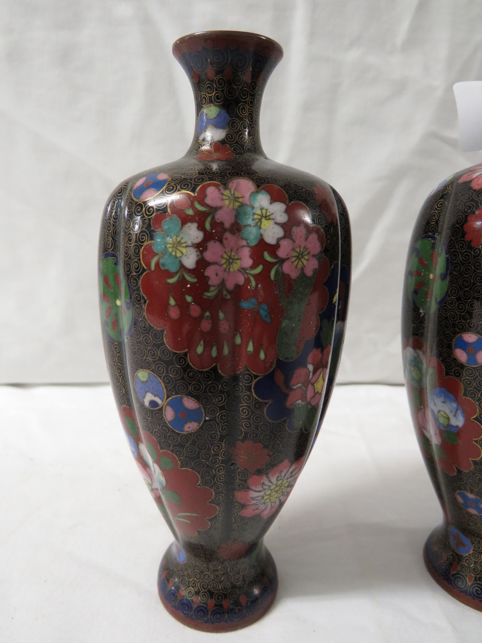 PAIR OF SMALL BLACK GROUND RIBBED CLOISONNE ENAMELLED VASES PATTERNED WITH VARIOUS FLOWERS AND - Image 3 of 5