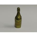 BRASS MATCH VESTA MODELLED AS CHAMPAGNE BOTTLE AND ENGRAVED 'VEUVE CLIQUOT'