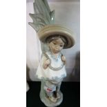 LLADRO FIGURINE OF BOY WEARING PONCHO AND SOMBRERO CARRYING RUSHES