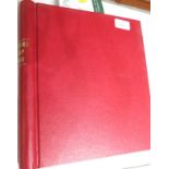 A red Stamford stamp album including seven Victorian one penny reds, two Victorian penny blues and