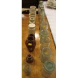 Six stone jars and thirteen glass bottles