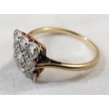 18 ct gold ring with a platinum set cushion of nine small diamonds (each stone estimated at 0.05