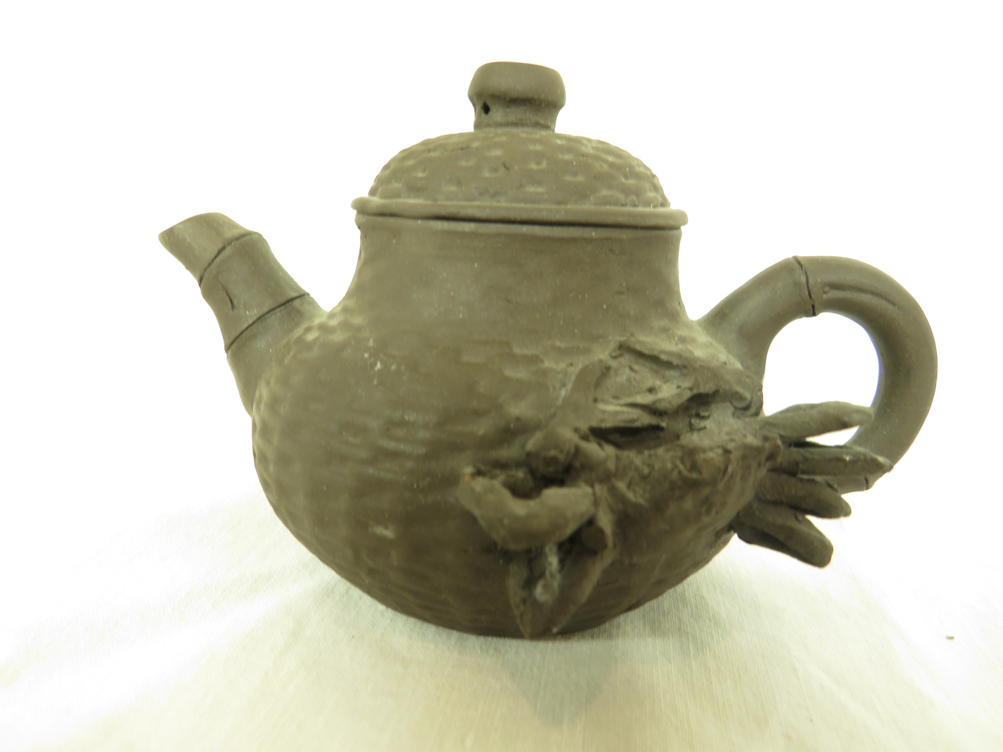 Four Far Eastern ceramics - a Yixing type pottery teapot with impressed marks to base, within the - Image 8 of 9