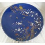 Large blue ground porcelain dish decorated in enamels and gilding with moon and clouds over a