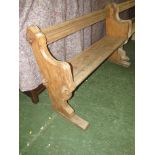 A small church pew in stripped light wood, thought to be French (159cm length)