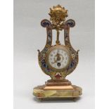 French style ormolu and enamel mantel clock of lyre shape, the white enamel dial (diameter 5cm) with