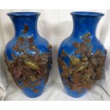 A pair of blue glazed pottery baluster vases, each with applied decoration of very deeply moulded