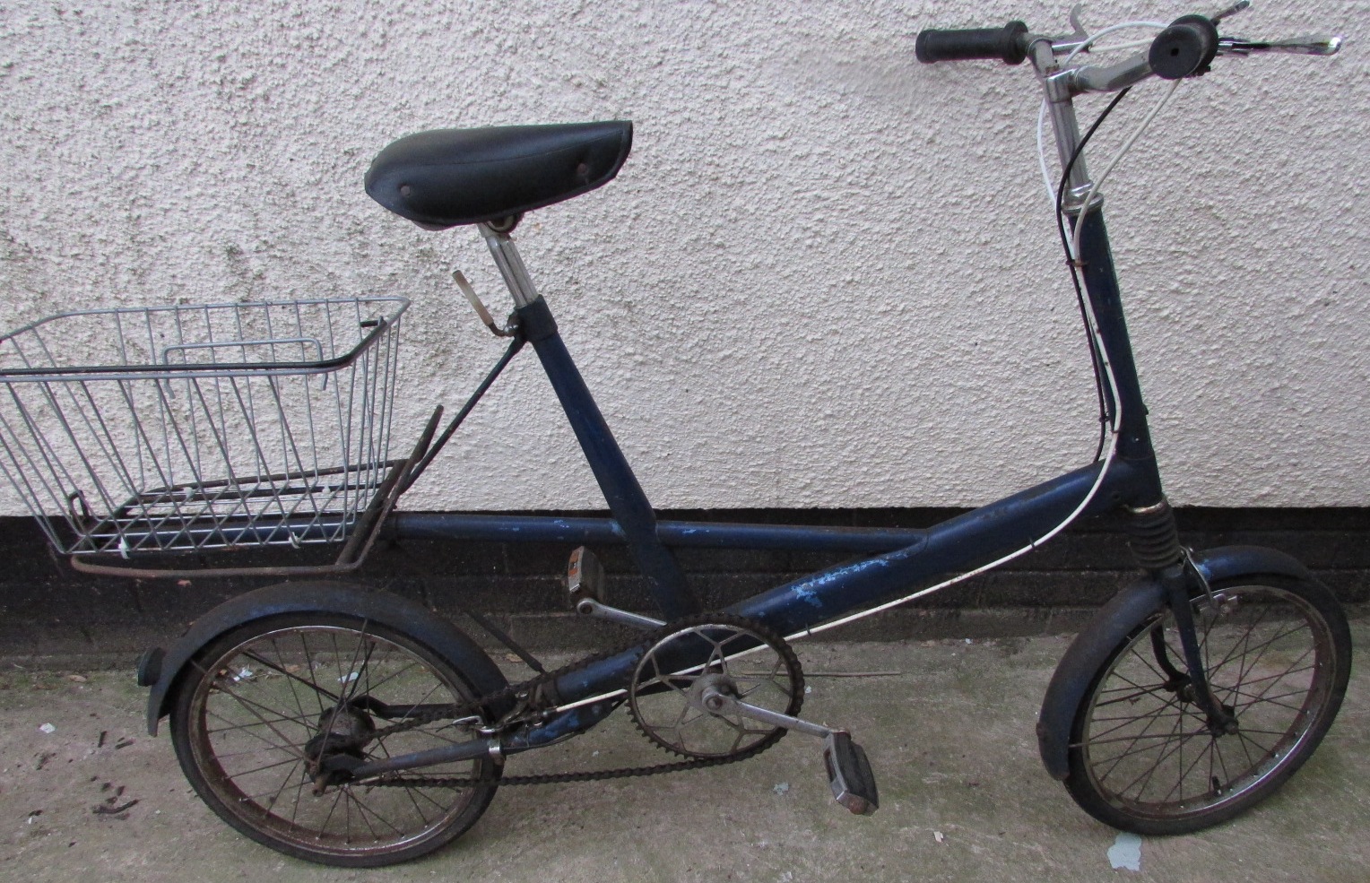 A Moulton bicycle with front suspension, blue