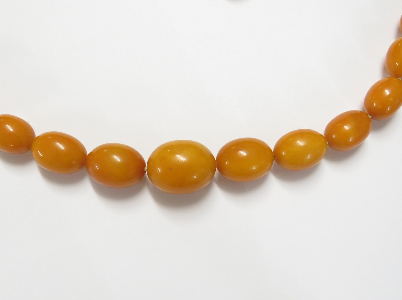 A necklace of graduated amber beads, length about 112cm, the largest bead approximately 3cm long - Image 4 of 6