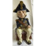 A large pottery Toby jug glazed and modelled as a seated figure of Nelson with telescope and