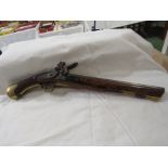 A 19th century flint lock pistol by Tower bearing a GR stamp with crown. The barrel bears the mark