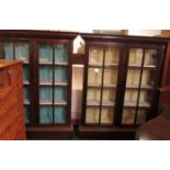 A pair of 19th century glazed mahogany bookcases with adjustable shelving. The doors each glazed