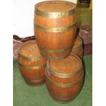 Four oak barrels with metal hoops, height 43cm, diameter 34cm