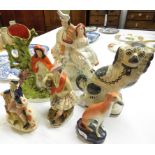 Six Staffordshire pottery figures and animals - flatback kilted couple with clock (height 36cm),