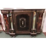 A late 19th century ebonised French neoclassical bow fronted and break front credenza inlaid with