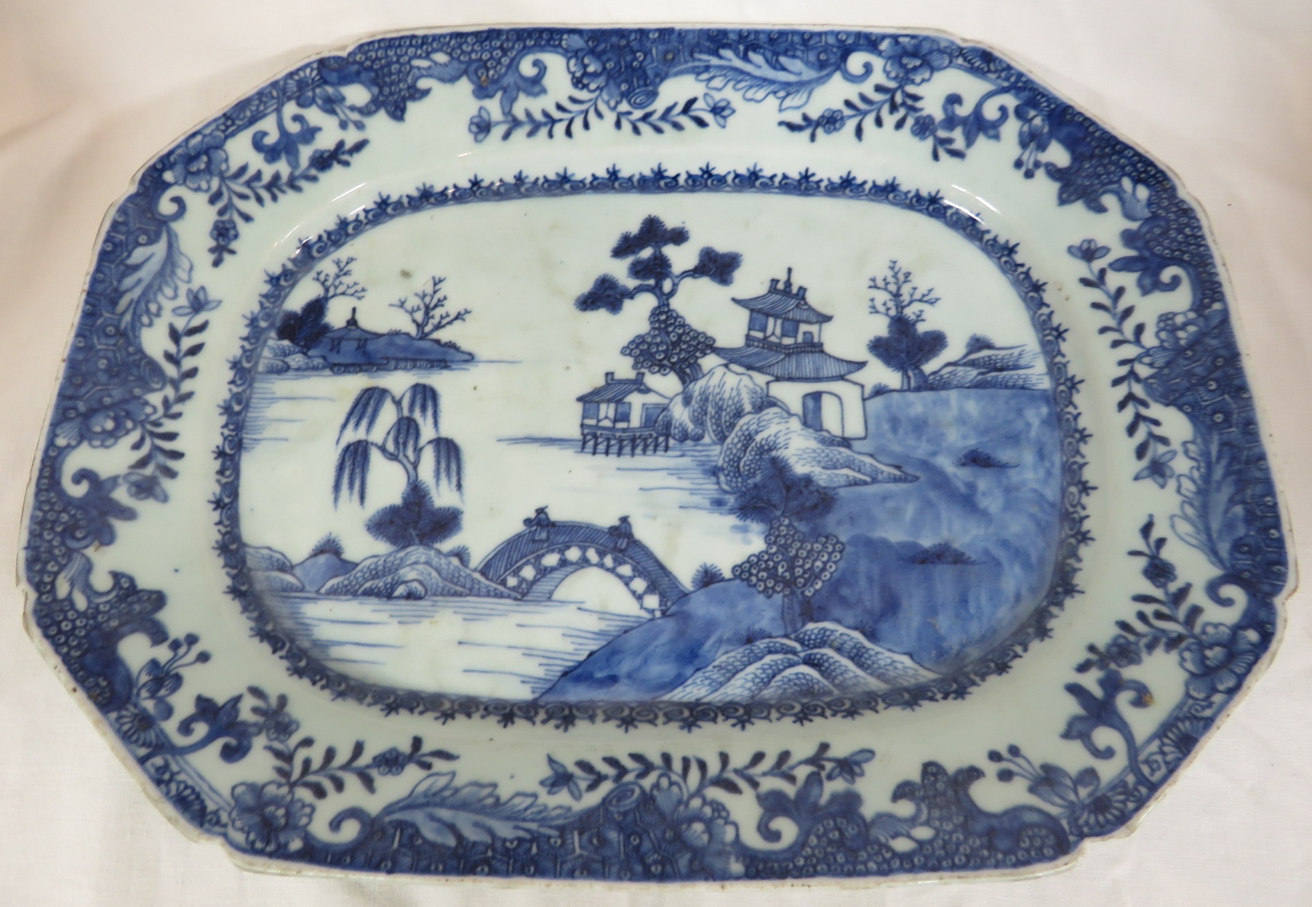 A porcelain dish or charger of octagonal oblong shape, decorated in underglaze blue in the Chinese
