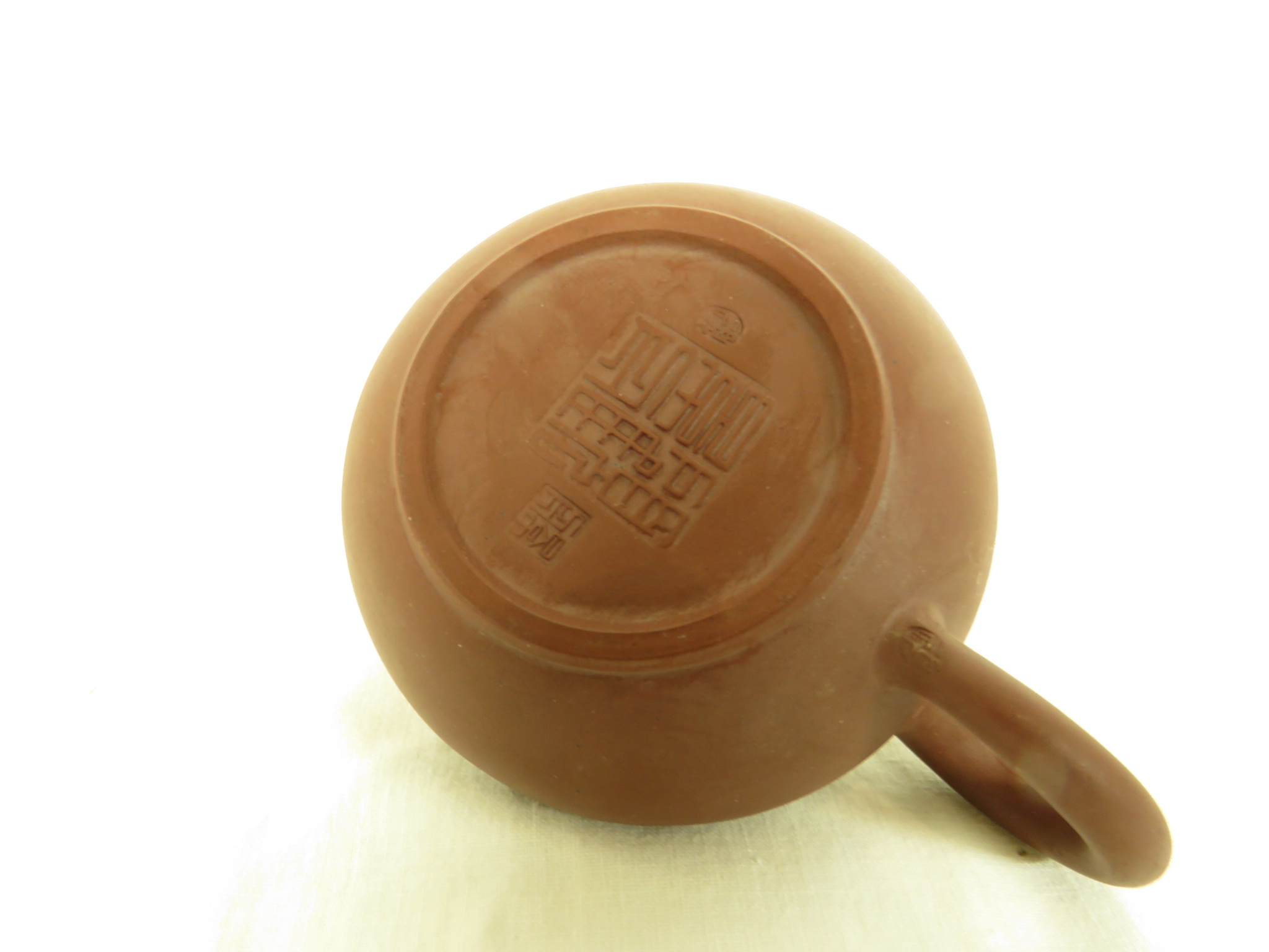 Four Far Eastern ceramics - a Yixing type pottery teapot with impressed marks to base, within the - Image 7 of 9