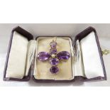An amethyst cross pendant of six gems with a seed pearl to the middle, the centre line of four