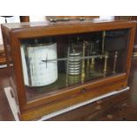 A Short and Mason Barograph serial no. M.O.13 in a hinged mahogany glass cabinet with lower