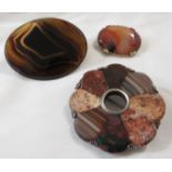 A circular flower-shape brooch set with eight divisions of polished stones, agate etc, hollow to the