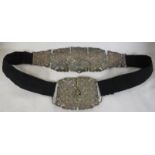 An electroplated and black fabric nurses belt and buckle, the back with five pierced plates with