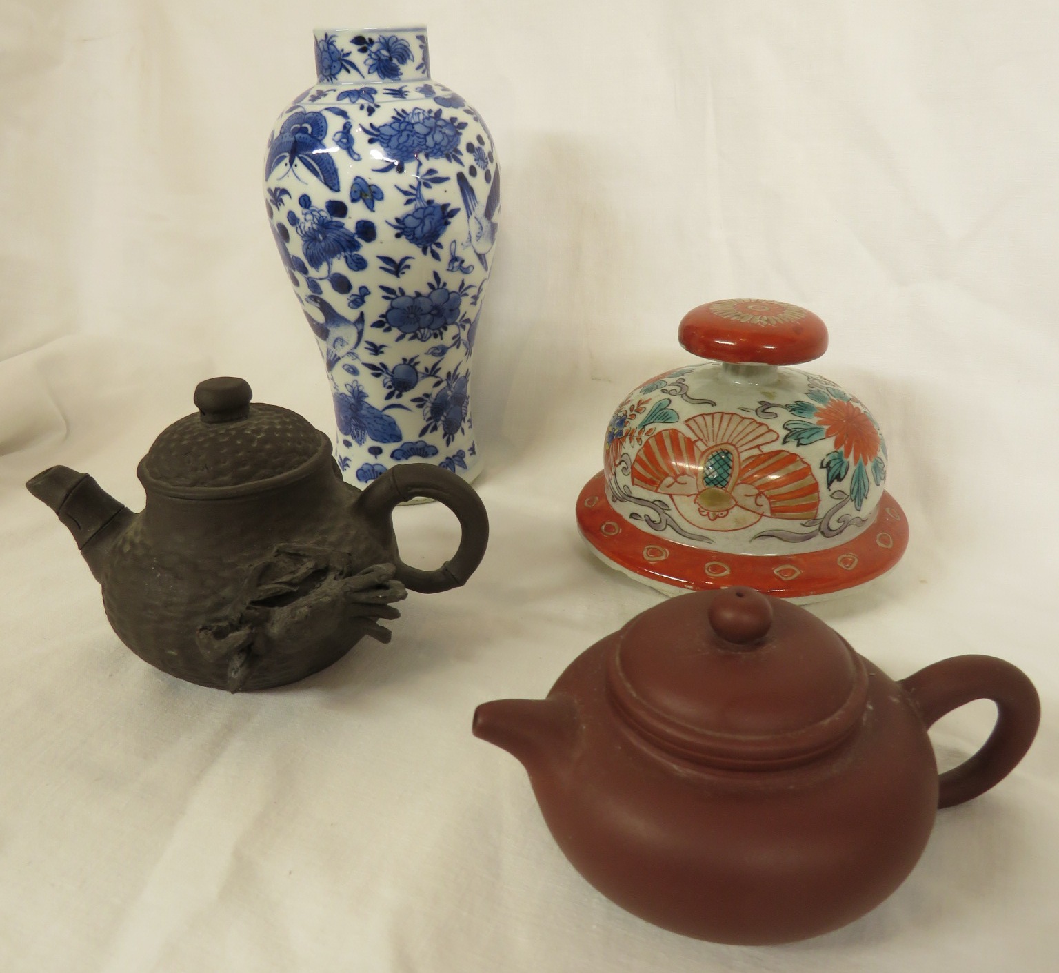 Four Far Eastern ceramics - a Yixing type pottery teapot with impressed marks to base, within the