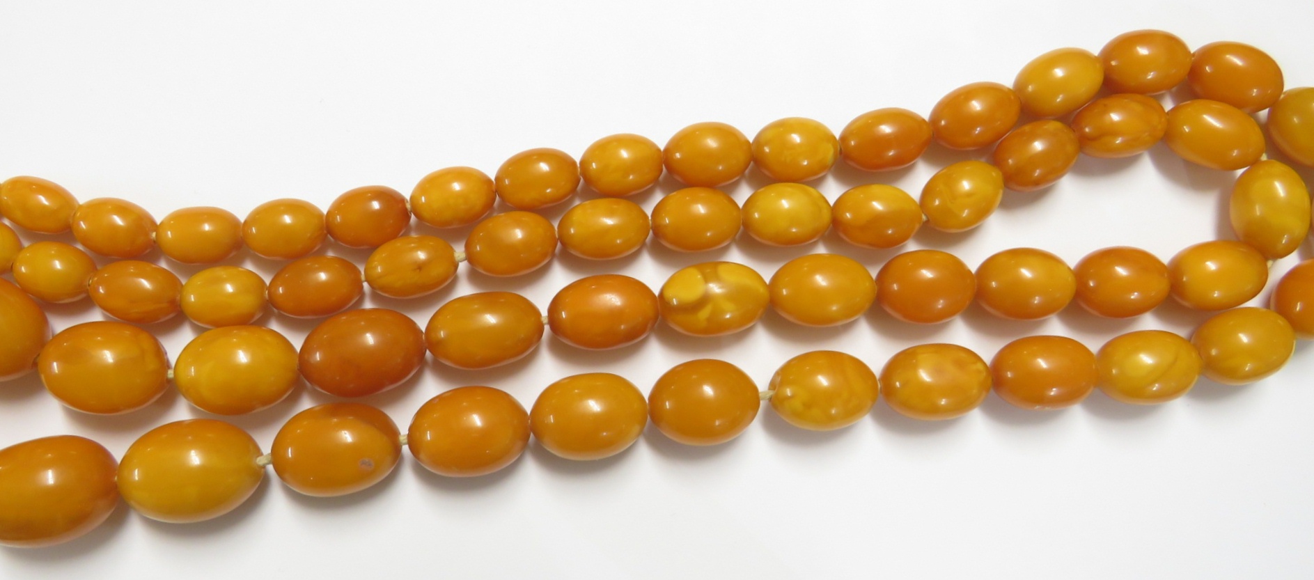 A necklace of graduated amber beads, length about 112cm, the largest bead approximately 3cm long - Image 6 of 6