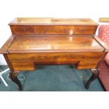 Victorian mahogany writing desk with a sliding cover revealing an extendable writing compartment