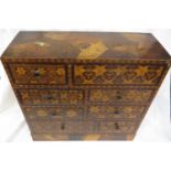 Japanese table standing cabinet of eight drawers, geometric inlay, the drawer fronts inlaid with