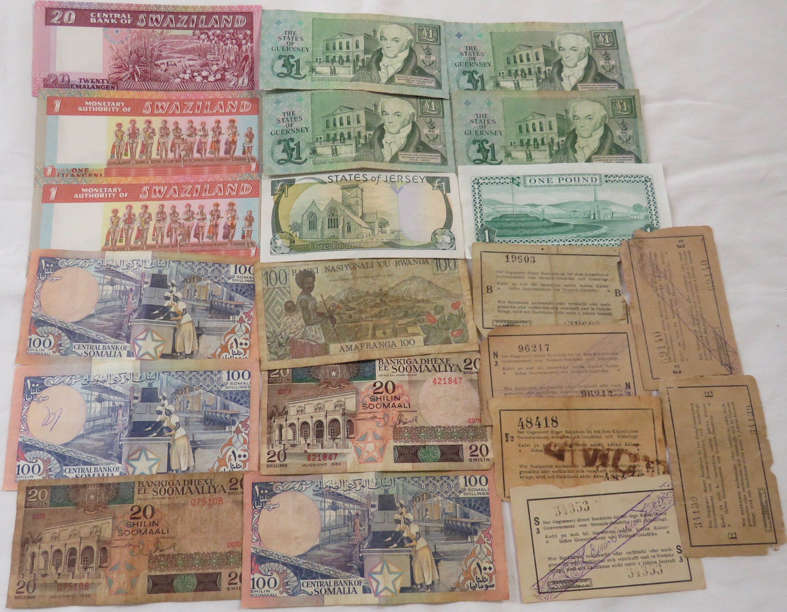 A collection of used bank notes from the following countries - Somalia, Swaziland and Rwanda;