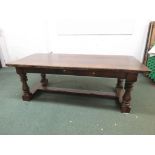 A large oak refectory table with bulbous baluster turned legs and 'H' stretchers, 228cm x 100cm x