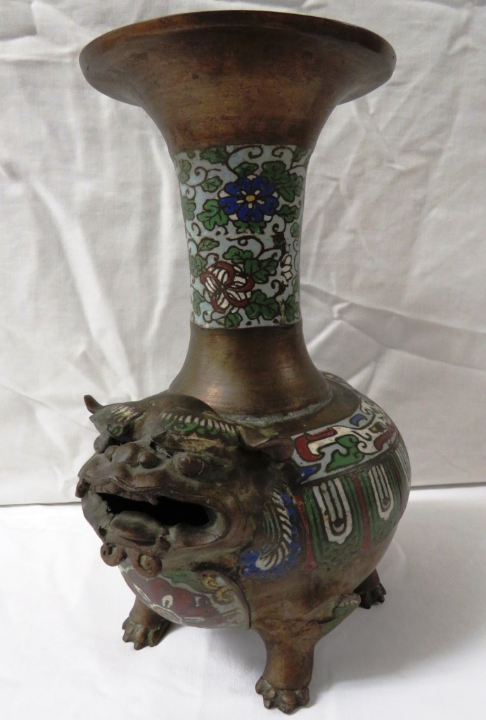 Chinese or Japanese bronze vase with flared neck and an oval body modelled as a grotesque animal