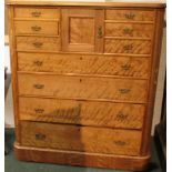 An Edwardian satin wood Scottish chest of drawers with four long drawers and central cabinet flanked