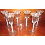 Six 19th century wine glasses with multi-strand air twist stems, bell-shape bowls etched with border