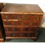 An 18th century walnut quarter veneered and cross banded chest of two short over three long