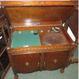 Baxterphone gramophone in oak cabinet, the two doors opening to reveal a triple divided and labelled