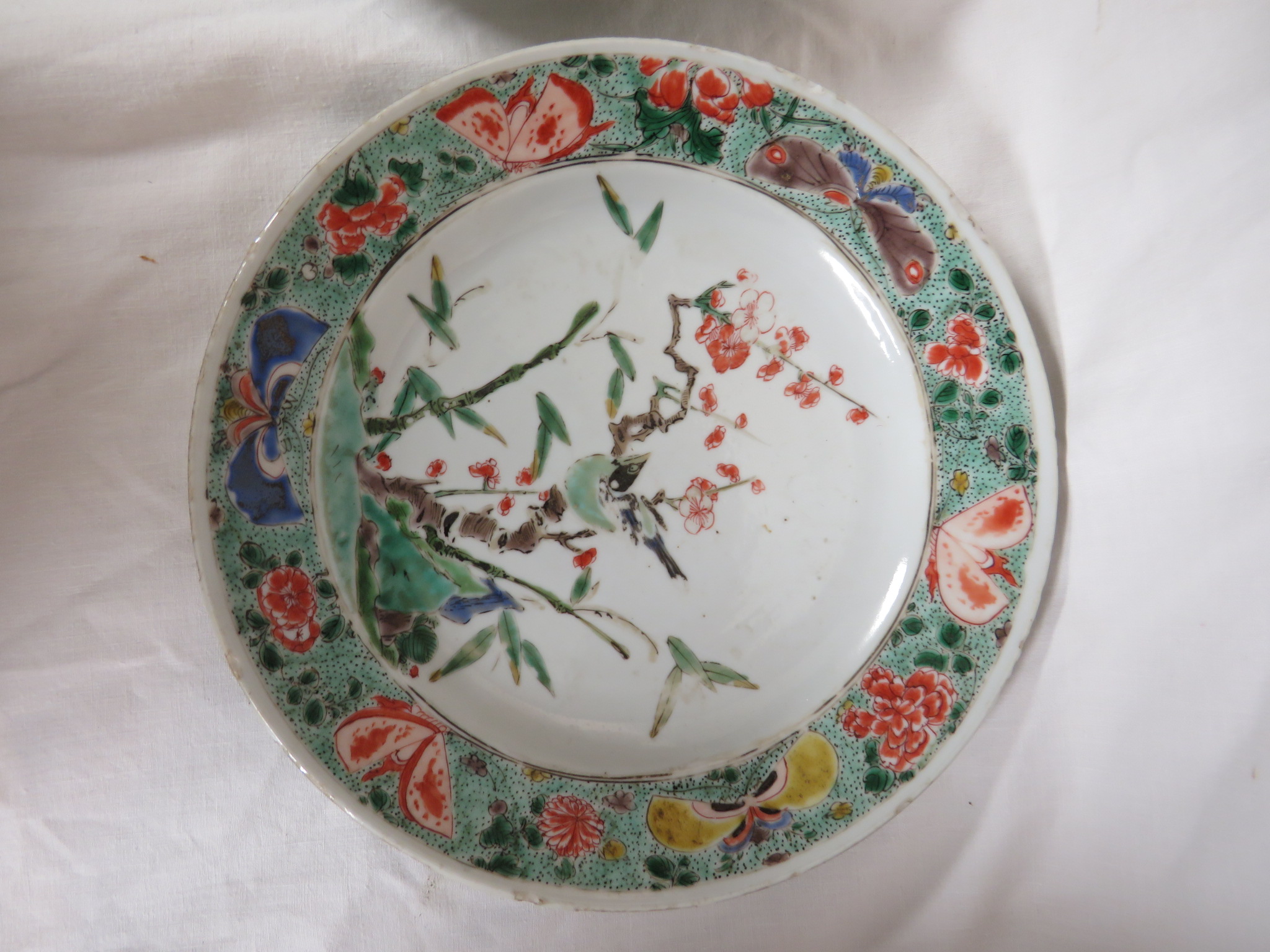 Two Chinese porcelain plates enamelled in the famille verte palette with flowering branch and - Image 3 of 10